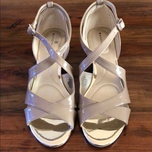 Nude patent leather wedges
